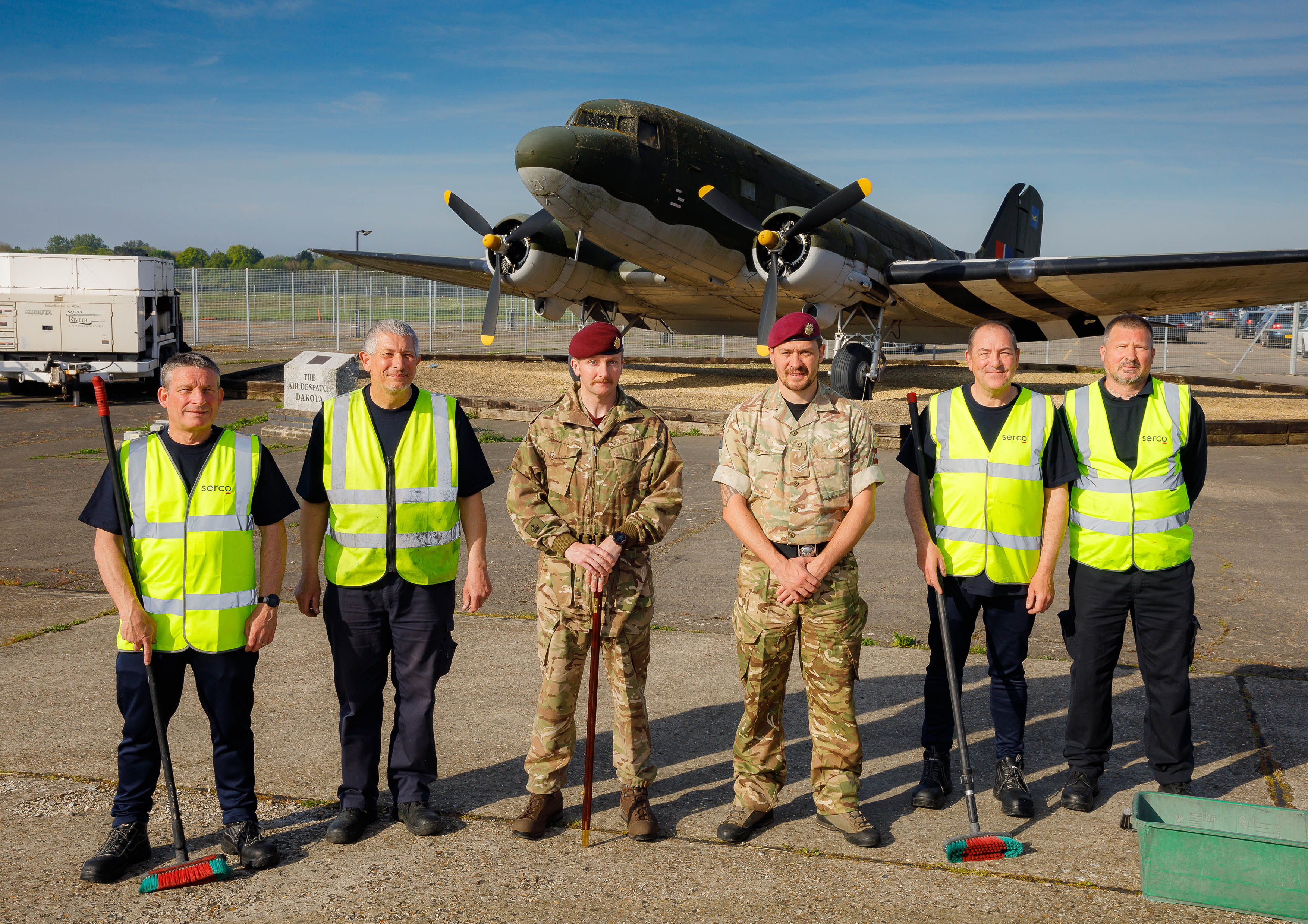 Photo: Members of 47 Air Despetch Squadron and the Serco Aircraft Wash Team, in group photograph in front of the C-47 Dakota aircraft